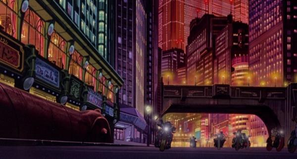 Neo-Tokyo: la città vive anche oltre il bordo dell’inquadratura.